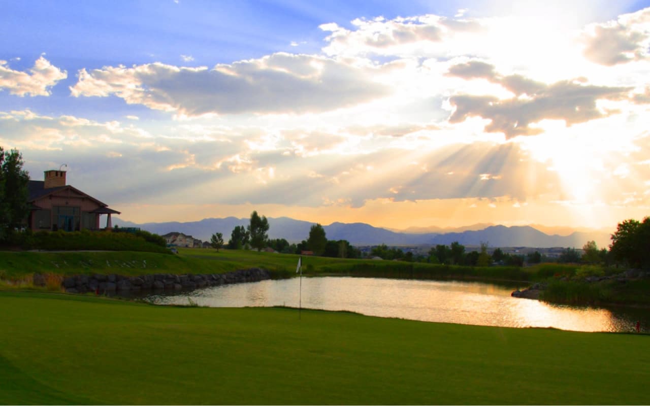 A scenic view of a lake surrounded by mountains.