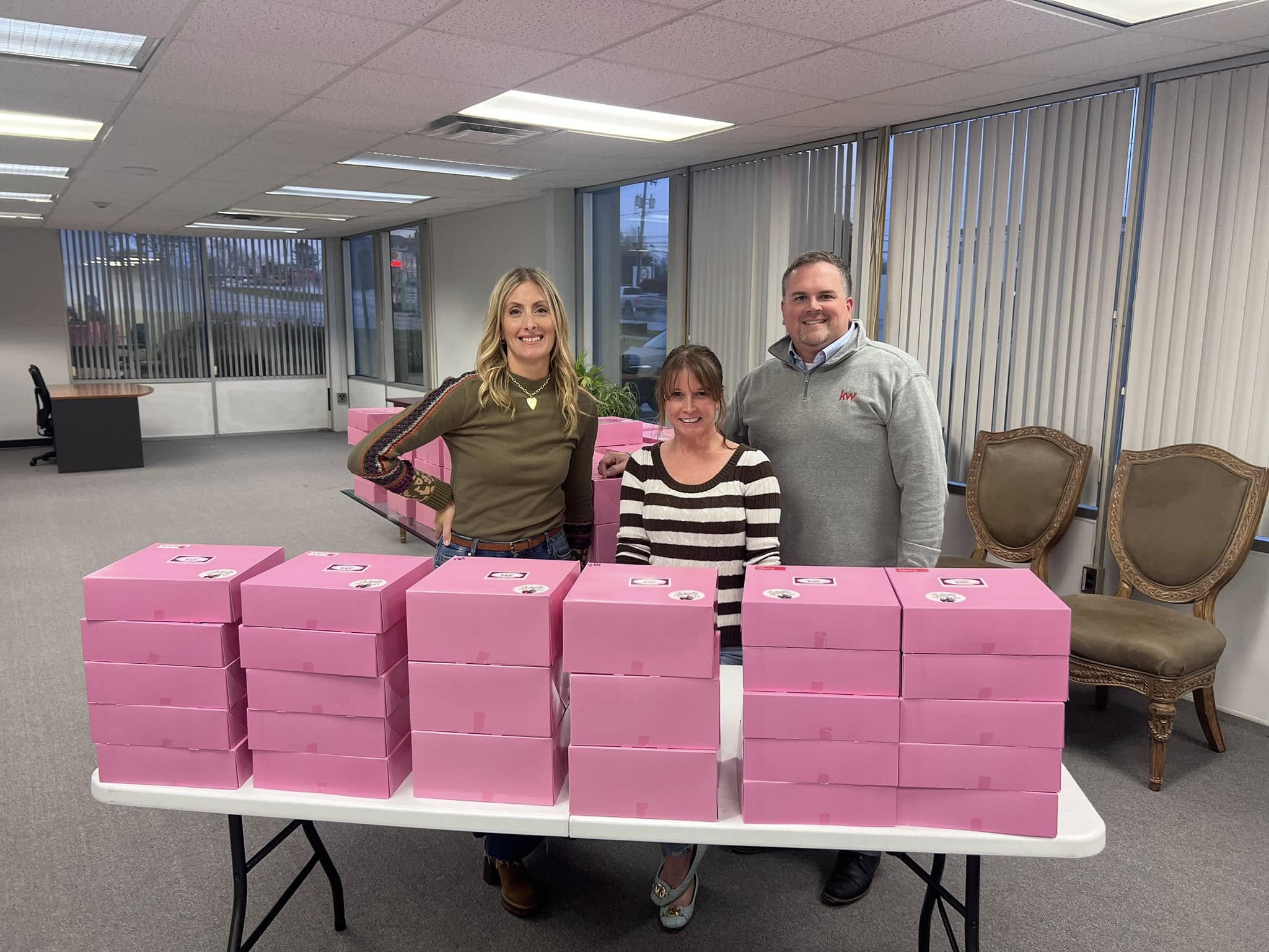 Team Becker’s 2023 Thanksgiving pie giveaway with boxes of pies ready for clients