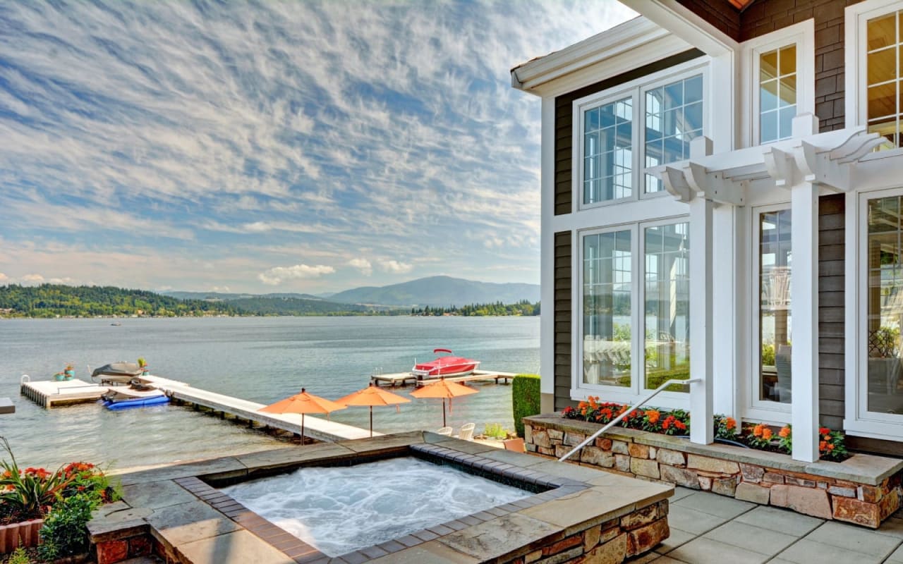 Stone foundation house with pool and lake view