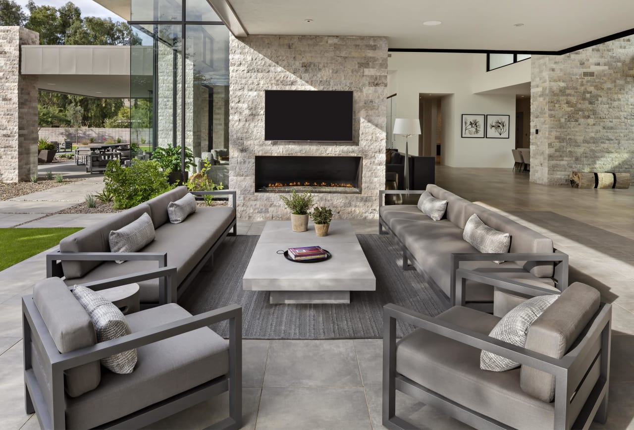 Covered patio at modern estate with indoor outdoor living