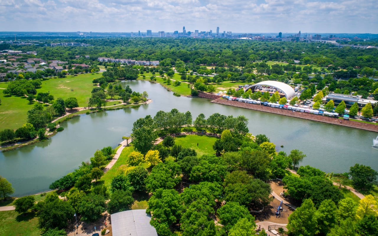 Panoramic View of Lake, Green Trees and Houses