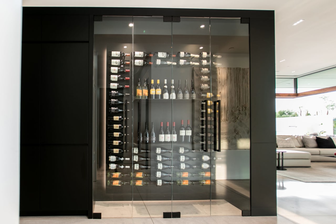 Glass wine room in modern luxury home