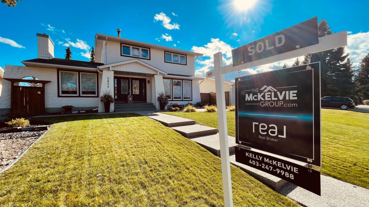 A sold sign in front of a house