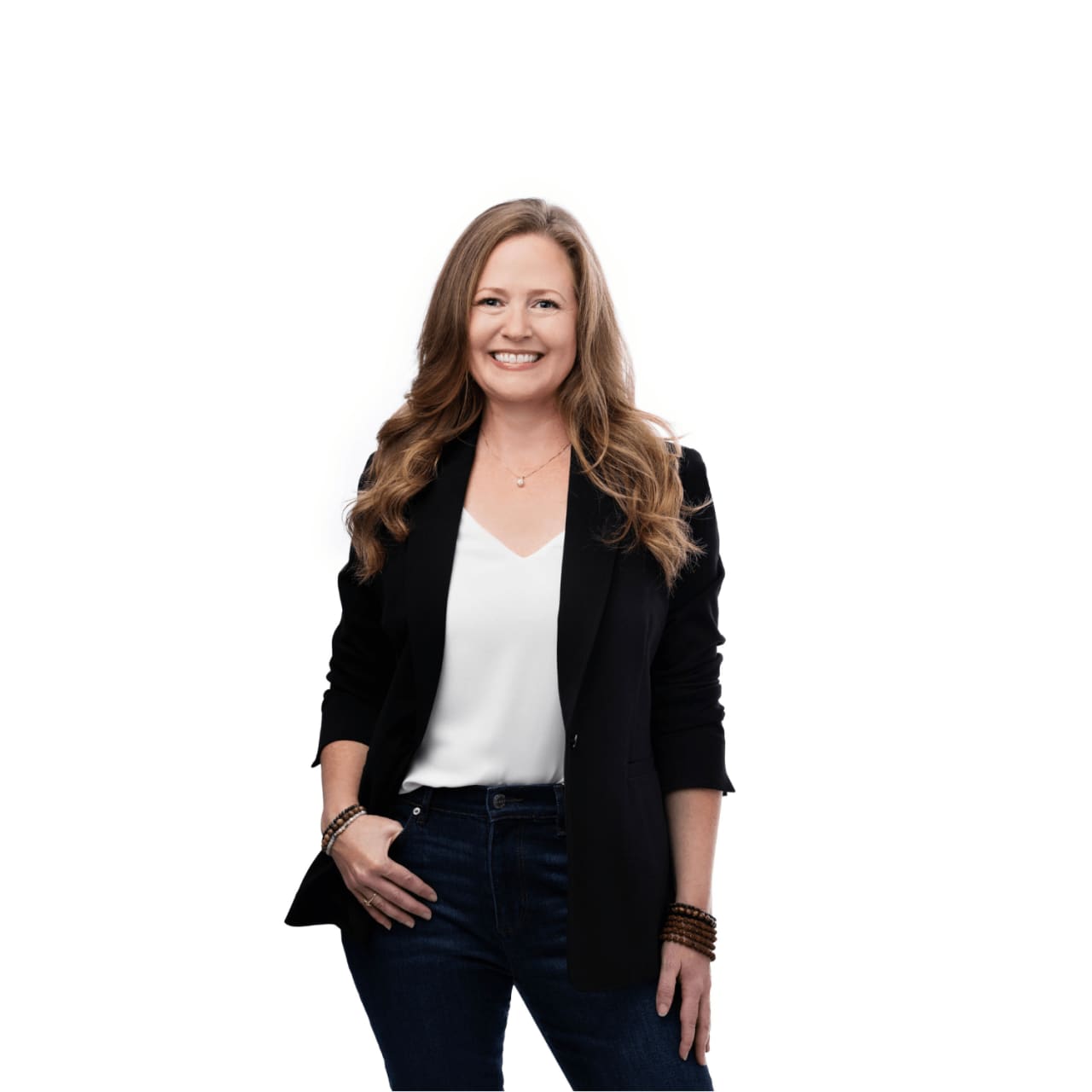 A professional smiling photo of Sarah Goldie McKinzie wearing a black blazer over a white blouse. 