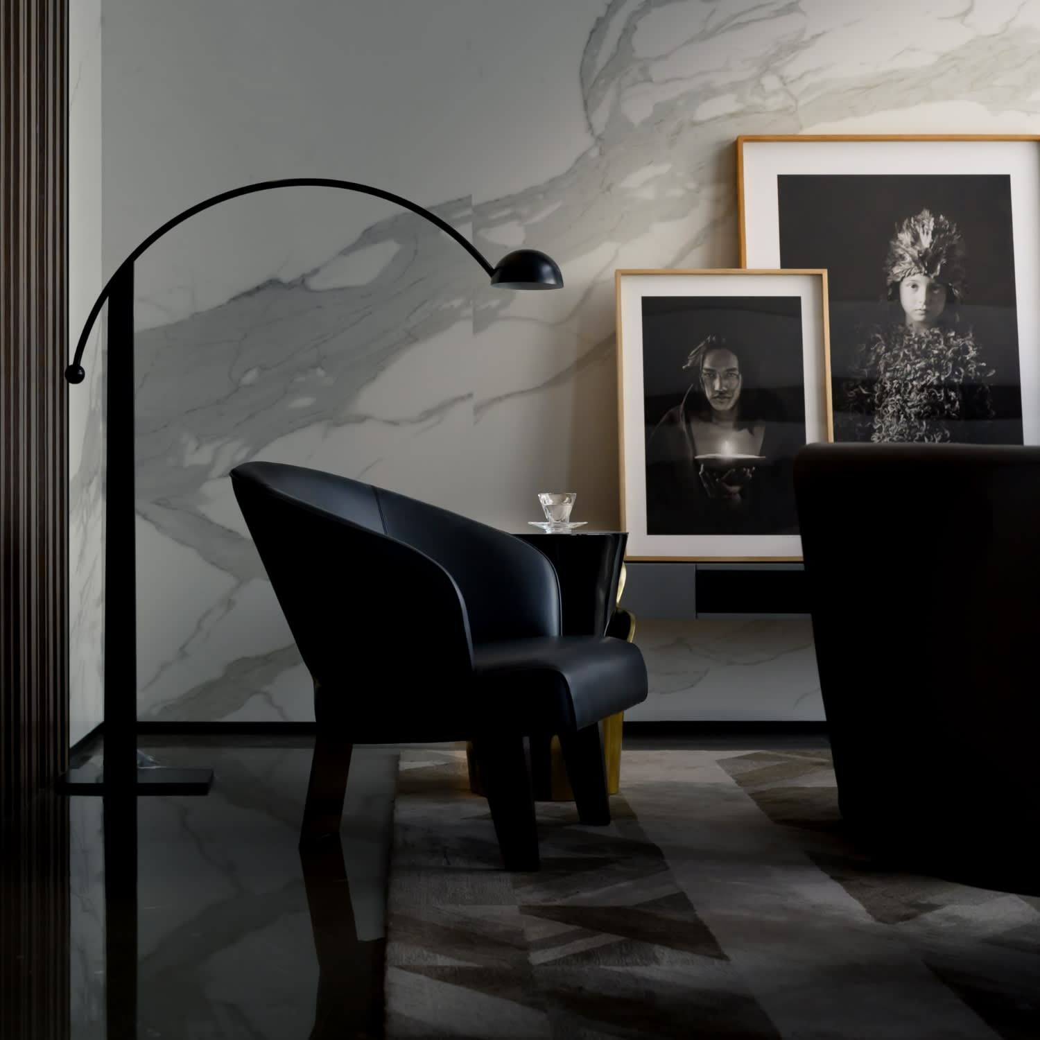  A chic, modern interior space dominated by dark tones and sophisticated elements.