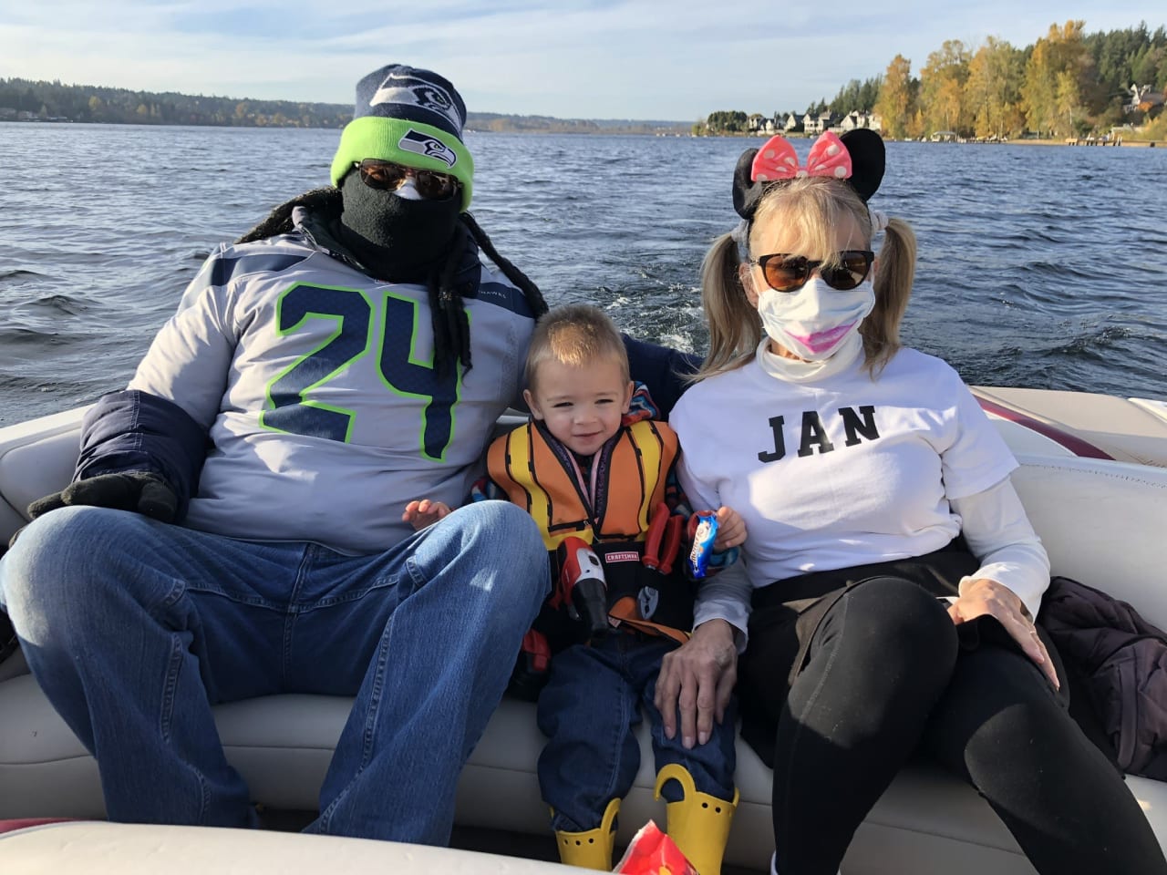 a family riding on a speedboat in a lake