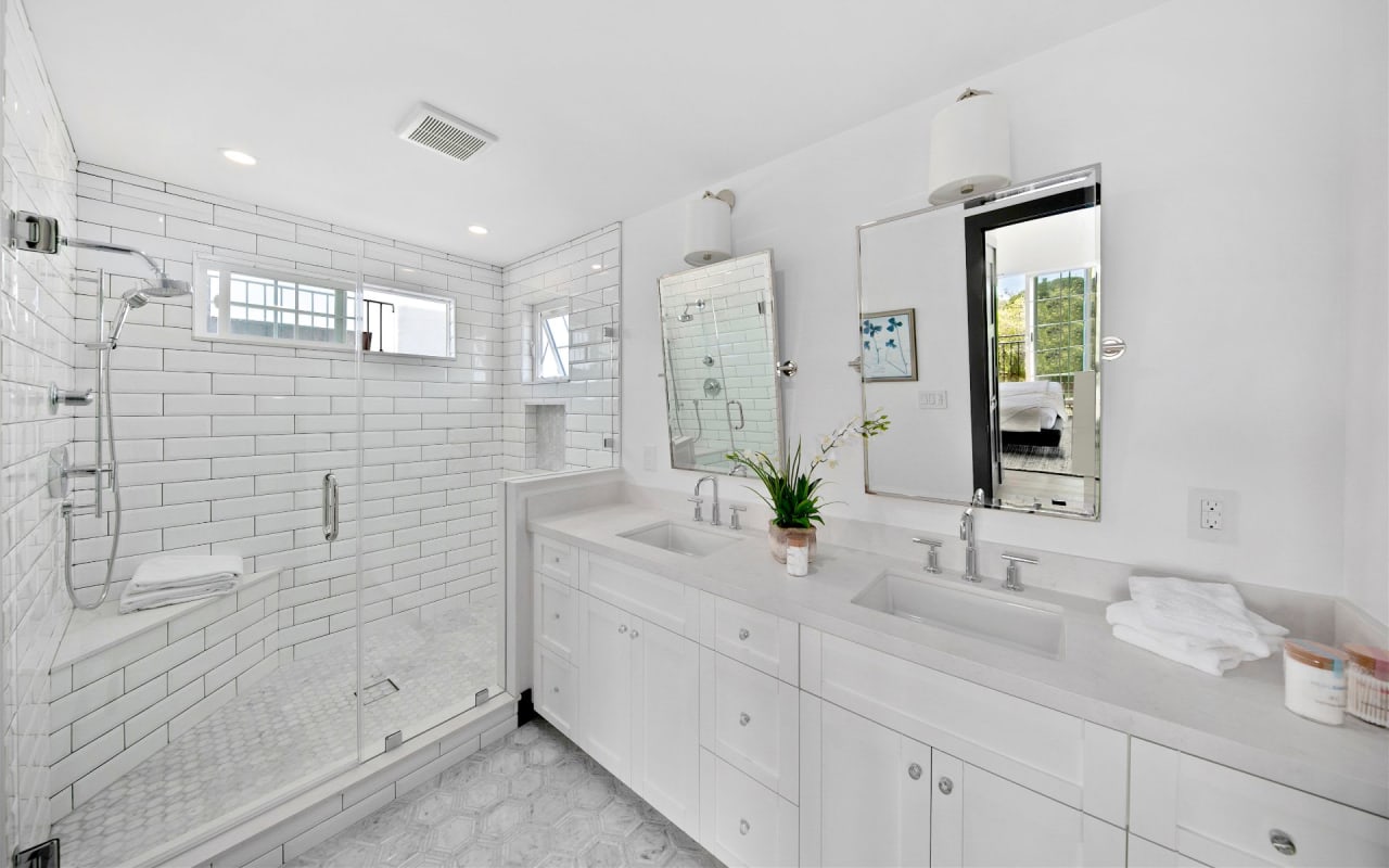 modern bathroom with white tile and marble floors