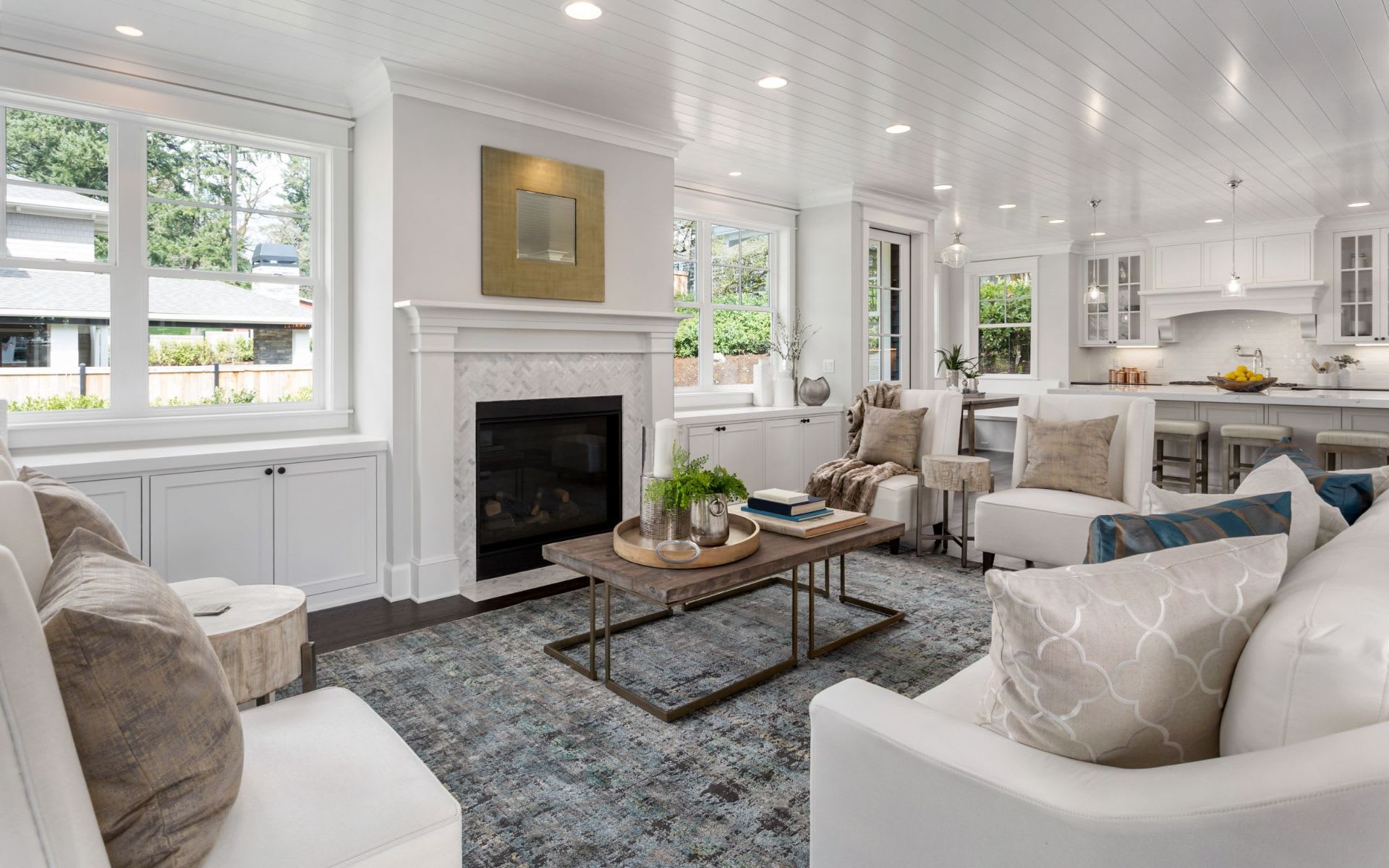 A spacious living room with a fireplace, a coffee table, and a sofa