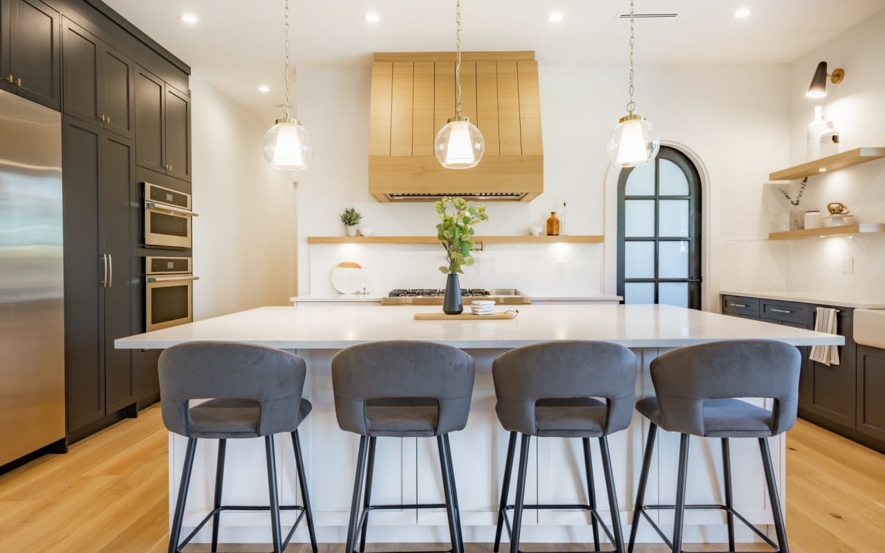 A modern kitchen with a large island in the center.