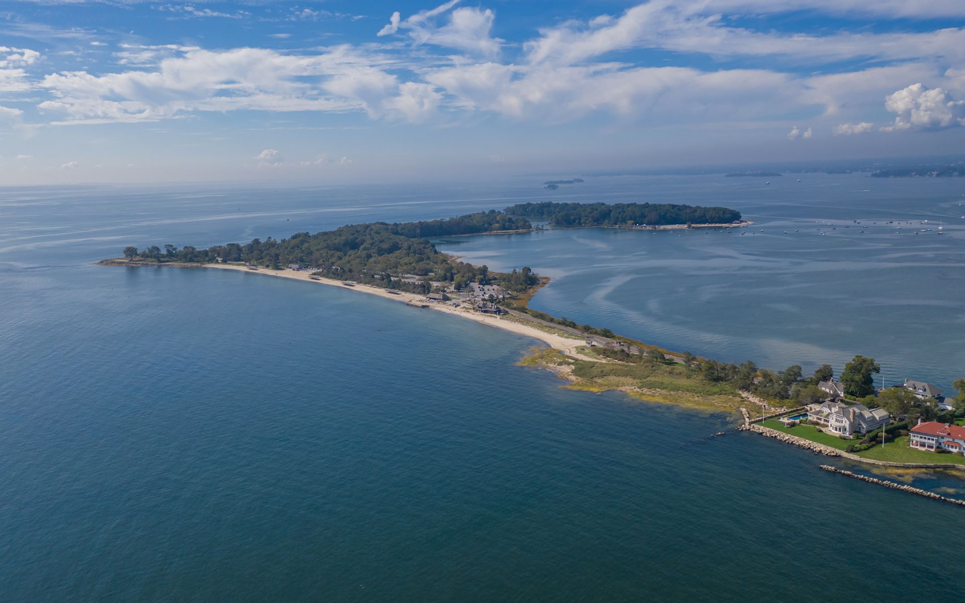 Cover photograph, aerial of Greenwich Harbor at golden hour, or a stately waterfront estate