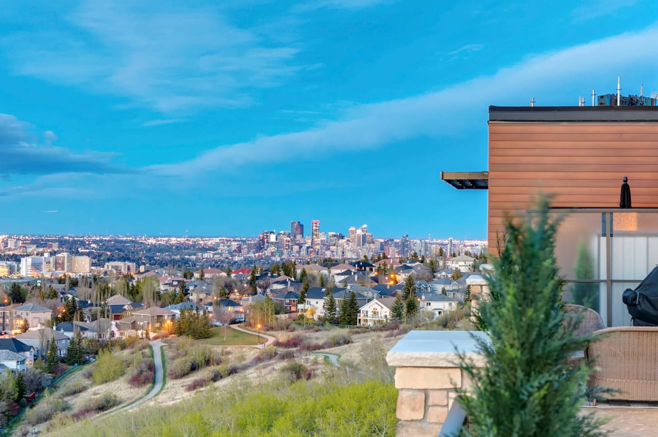 A view of a city skyline from a high-rise balcony