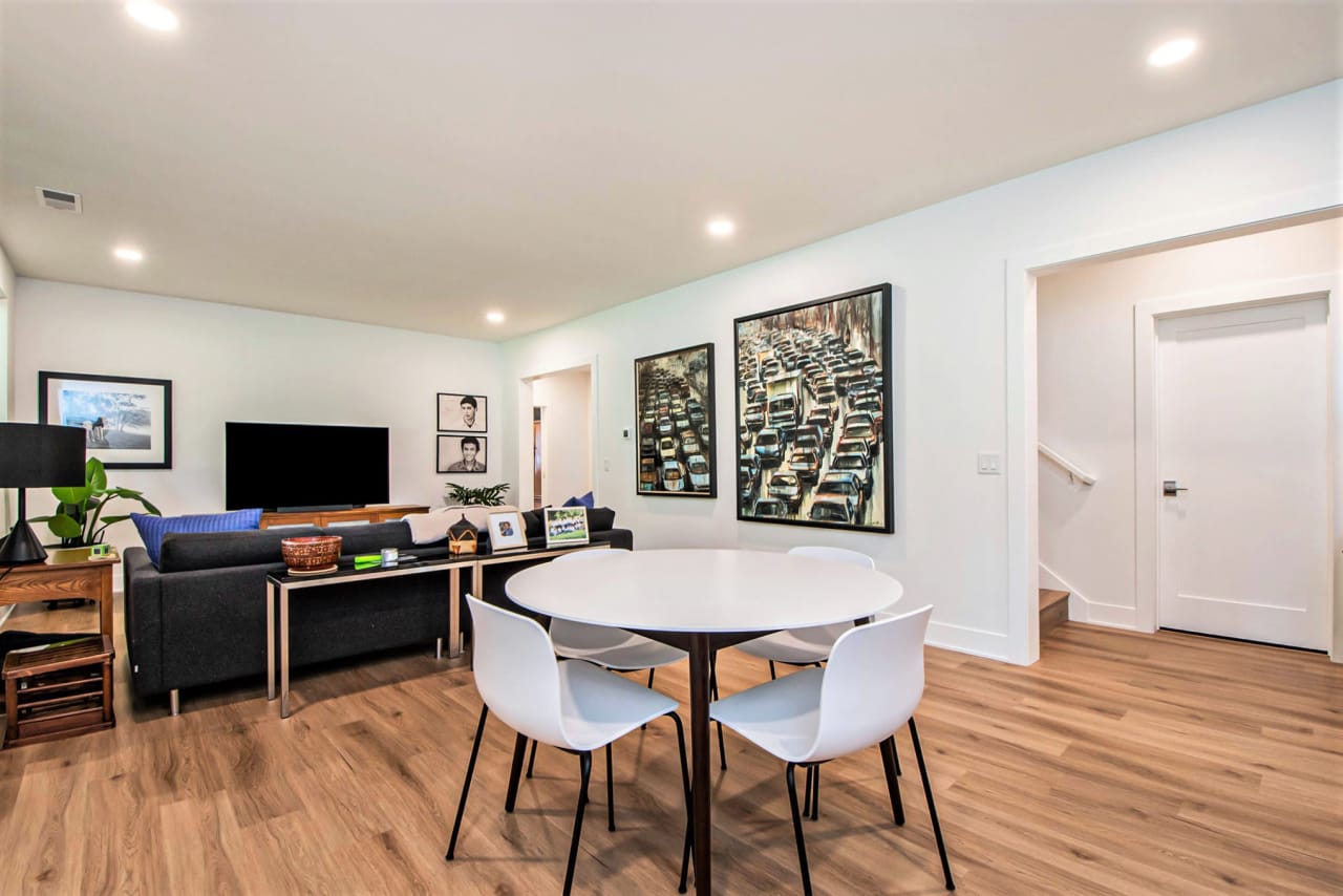 small dining table for four with living area in the background