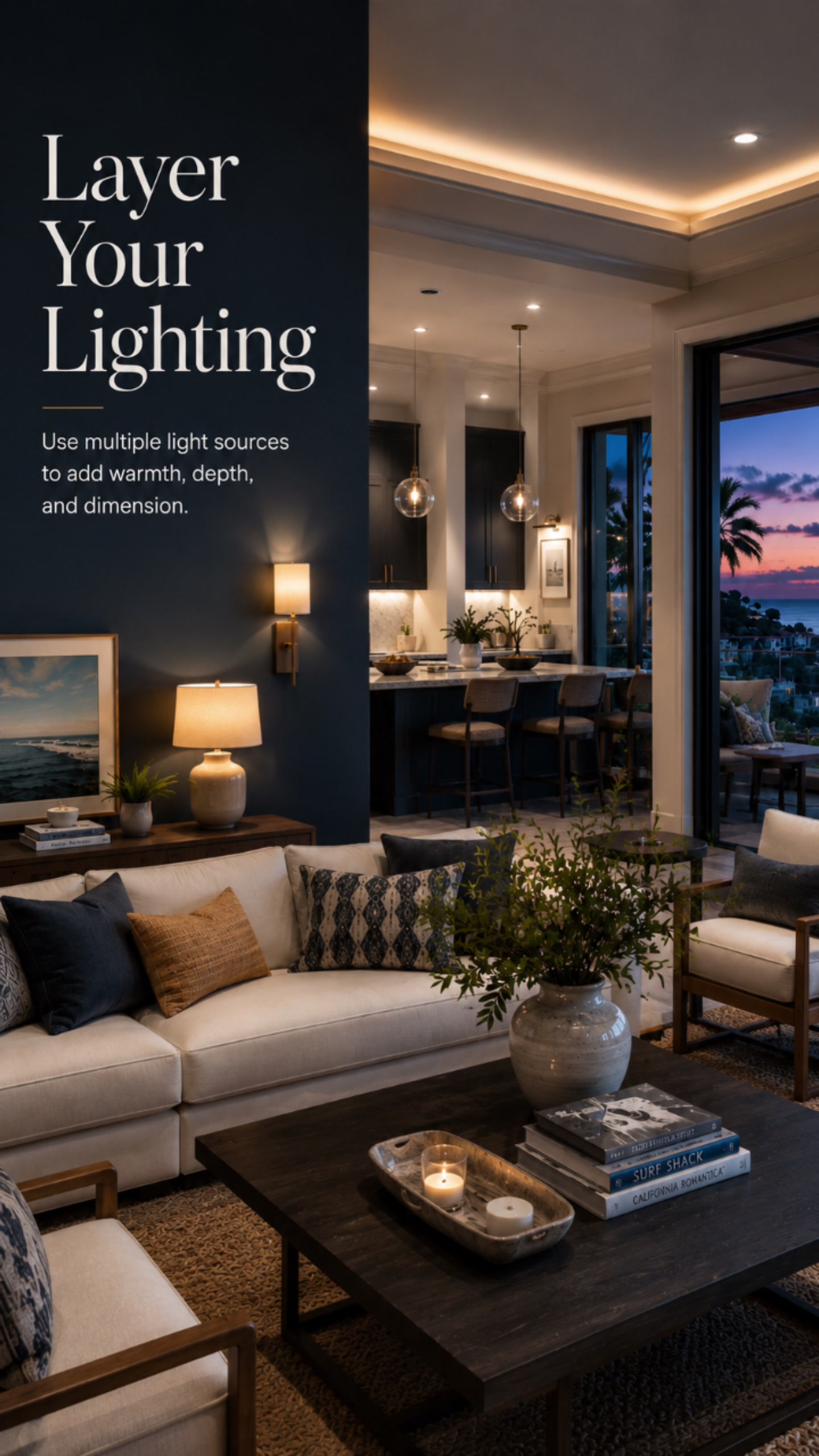 Layer your lighting — lamp light and candlelight layered in a warm coastal living room
