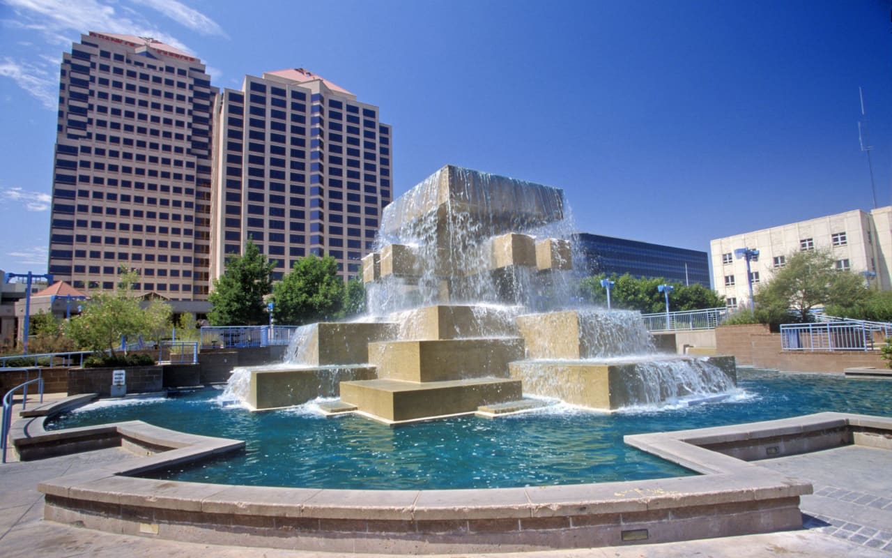 condo building with beautiful fountain