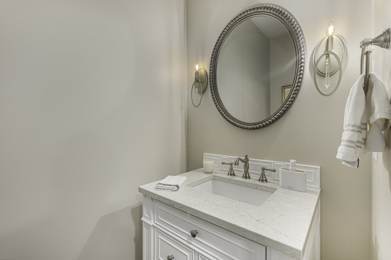 bathroom sink with large mirrors