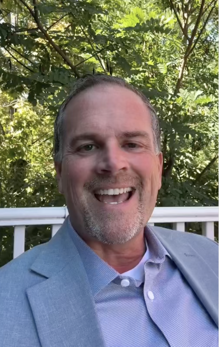 David Becker smiling outdoors