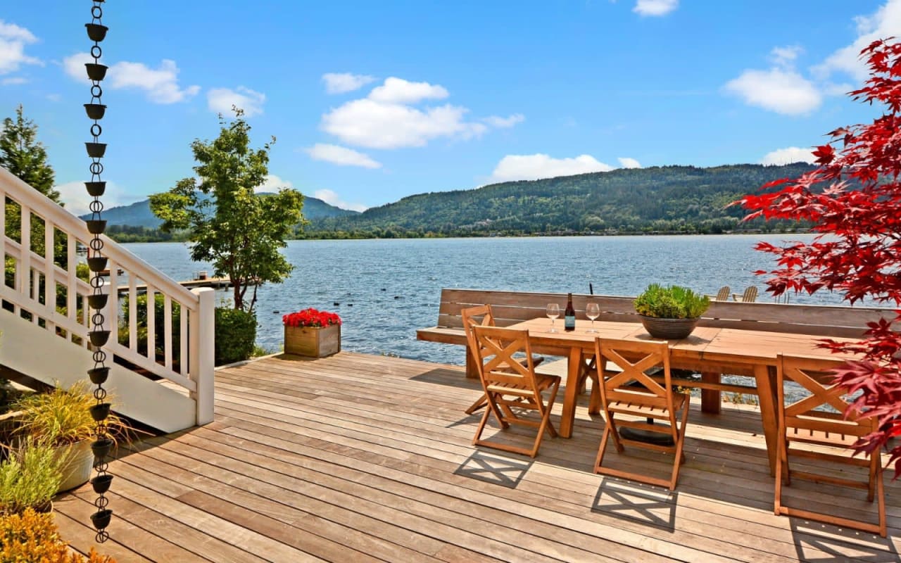 Lakefront deck with table and chairs