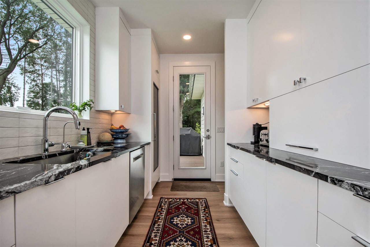 kitchen hallway with sink and window