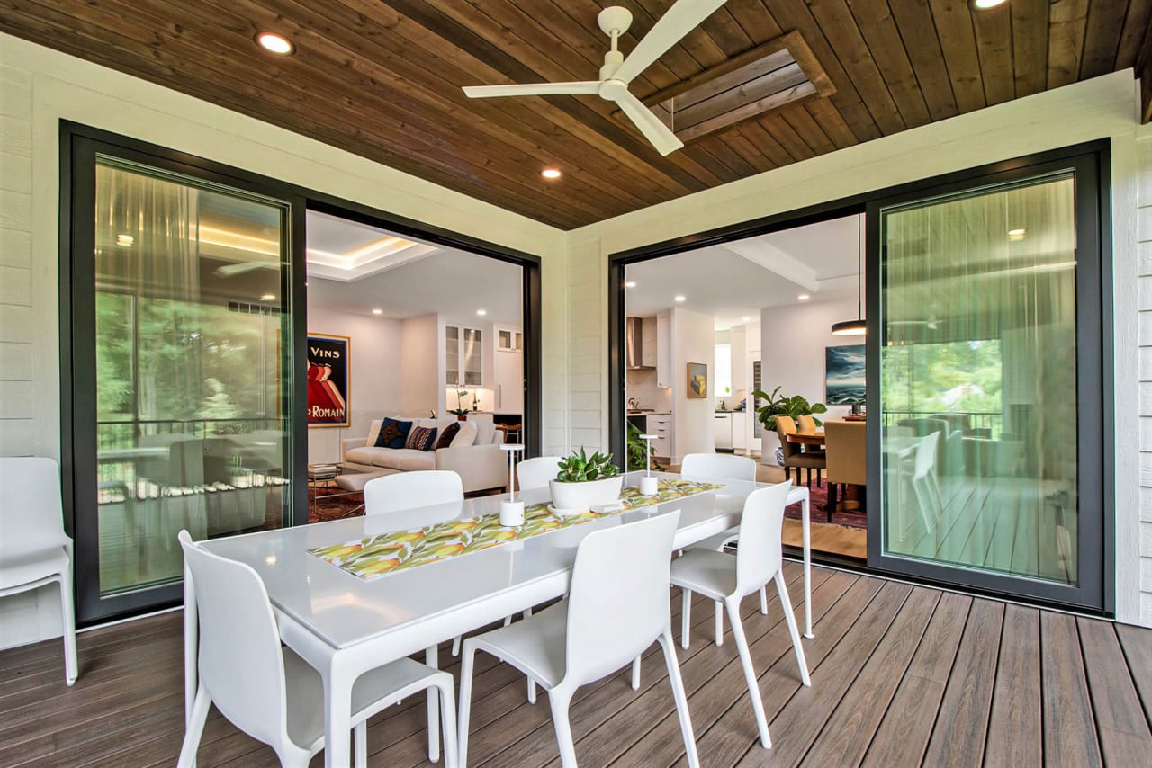 A patio with a table and four chairs.