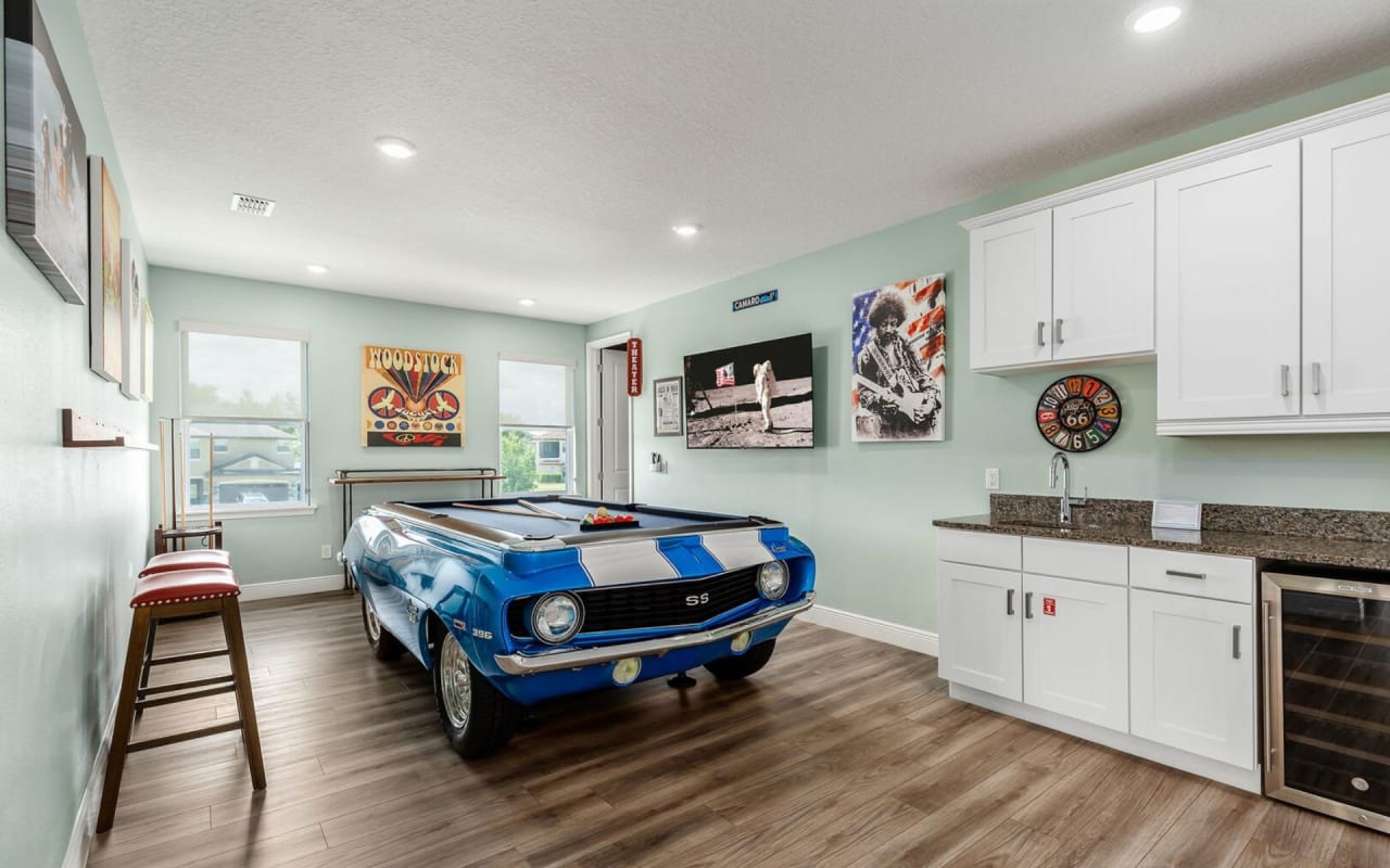 A pool table shaped like a classic muscle car.