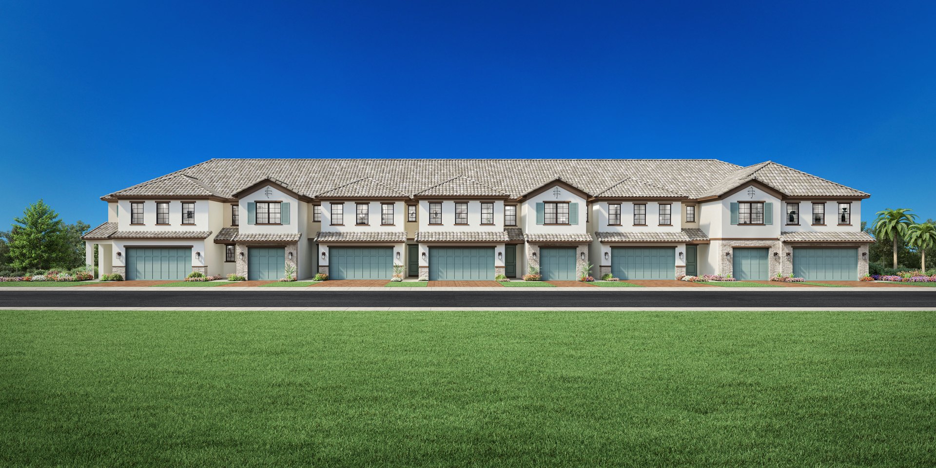 Toll Brothers rendering of a longer Summercrest townhome building with eight attached two story Mediterranean units and alternating one and two car garages