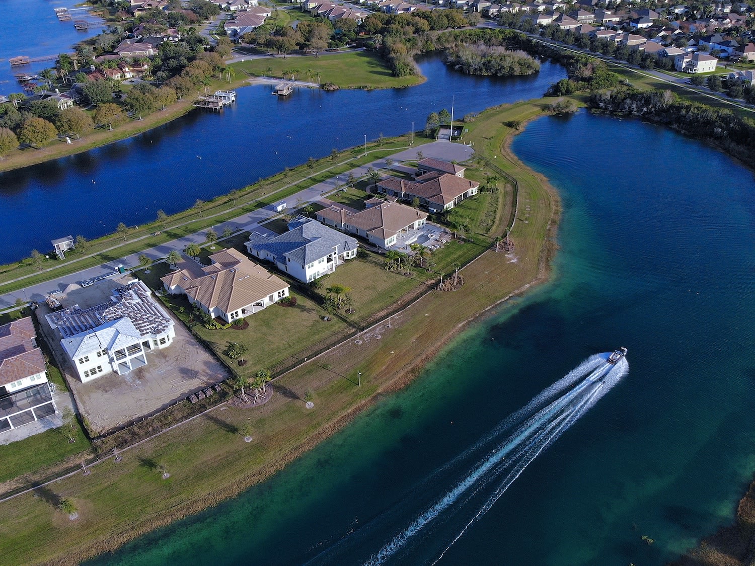 Winter Garden neighborhood Isles of Lake Hancock water ski boat and luxury homes