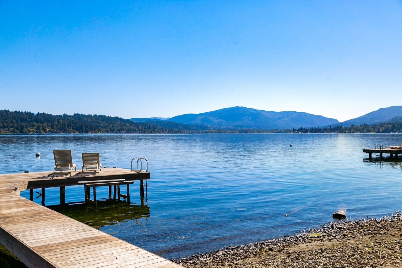 Chairs on a dock overlooking a lake