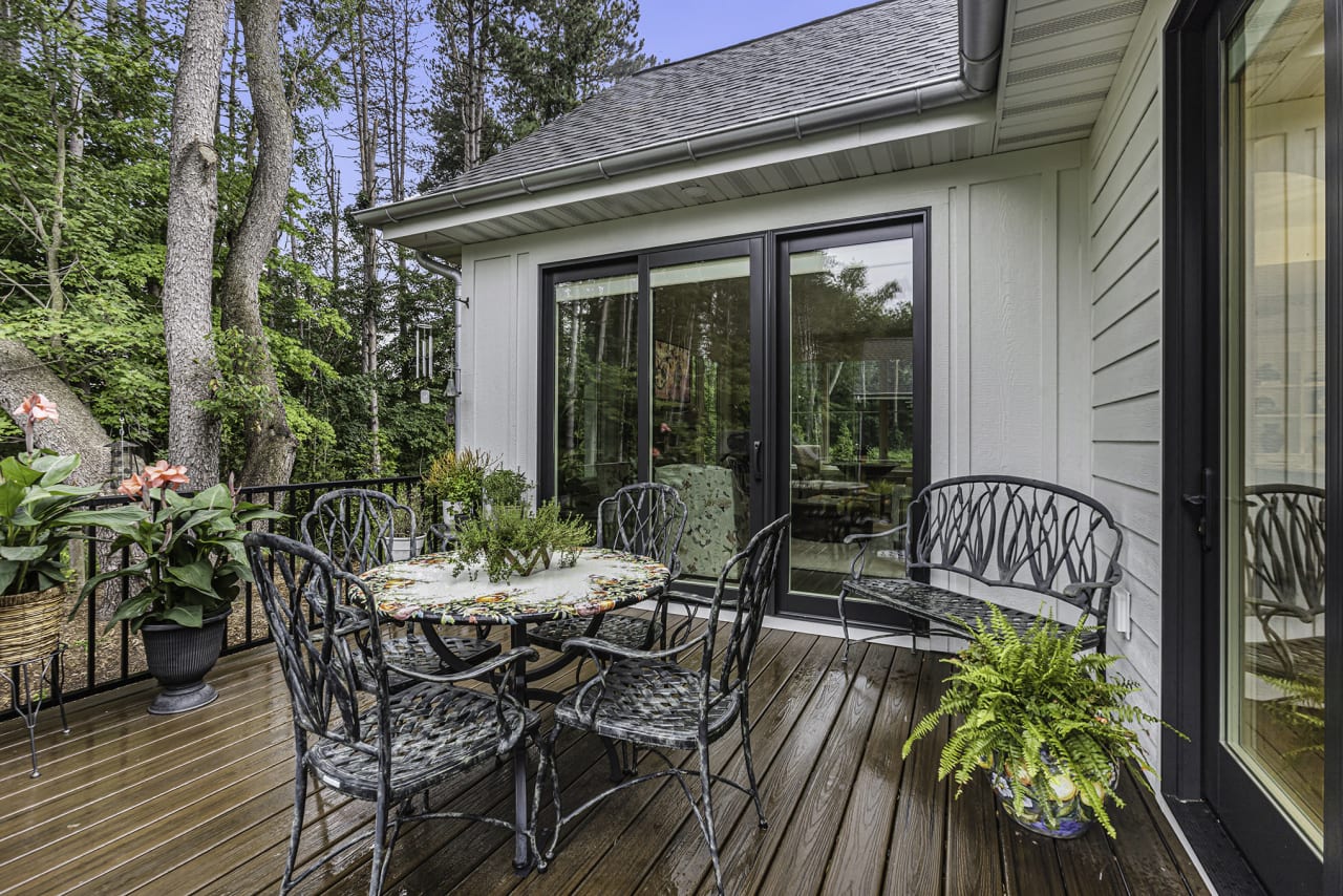 outdoor deck with a table and chairs