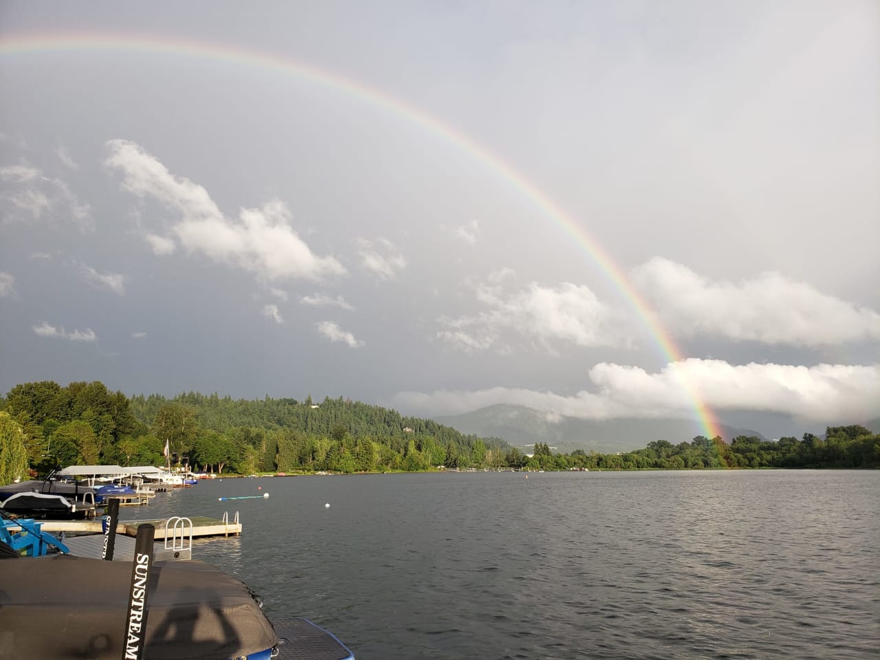 A rainbow over a lake