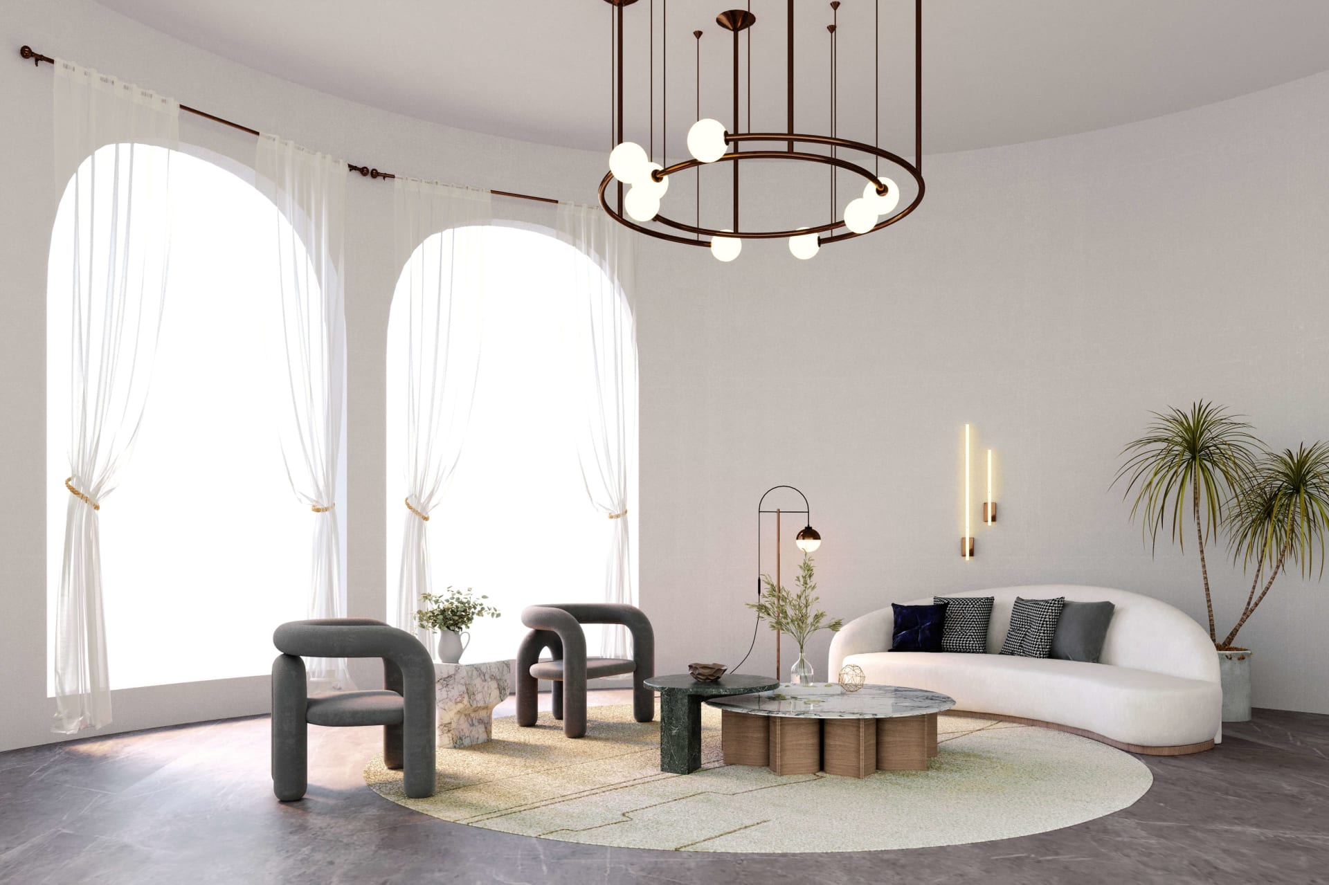 A living room with a white couch and modern chairs with curved backs, a round coffee table, and a large chandelier.