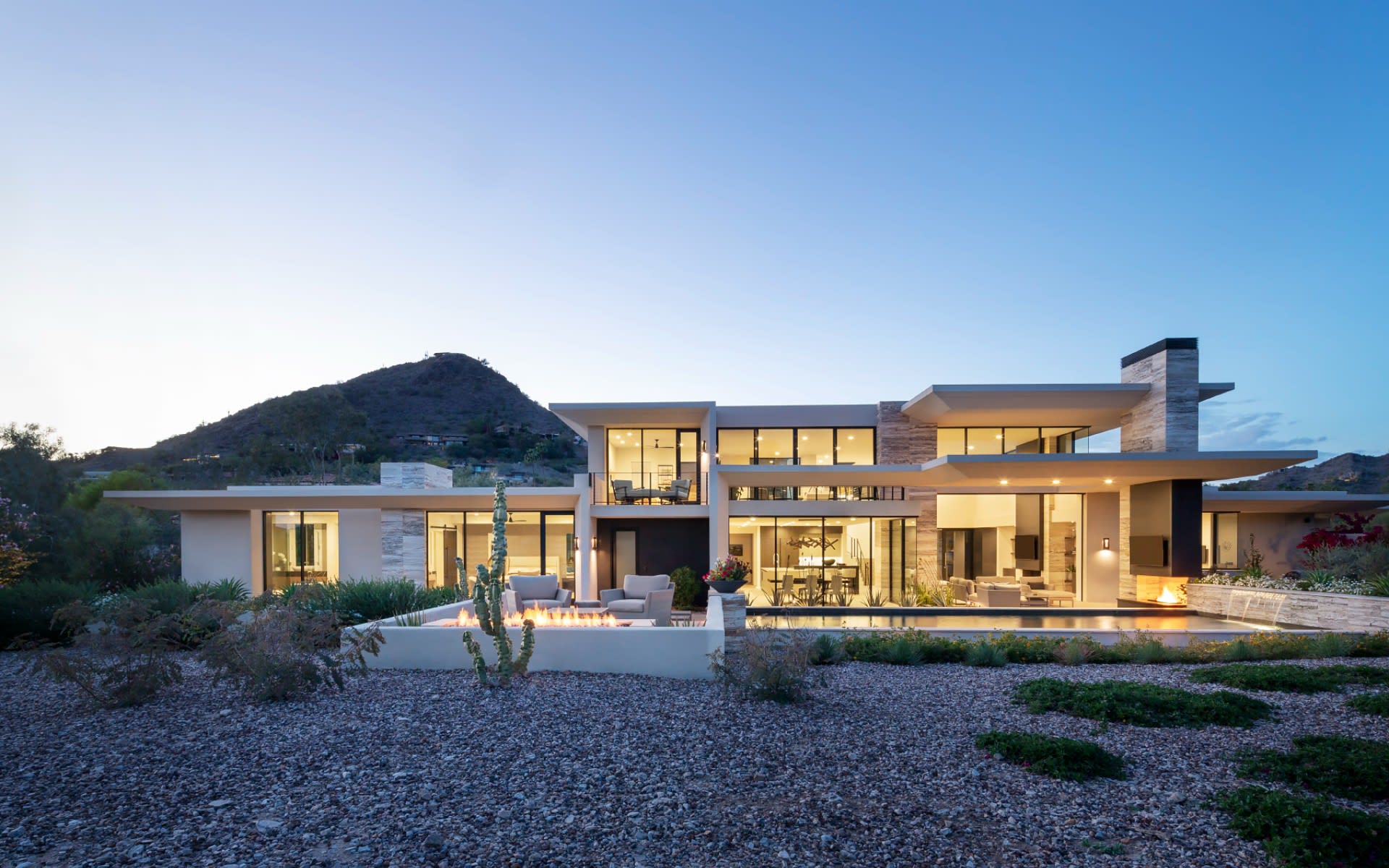 Exterior of pool and backyard of custom modern home