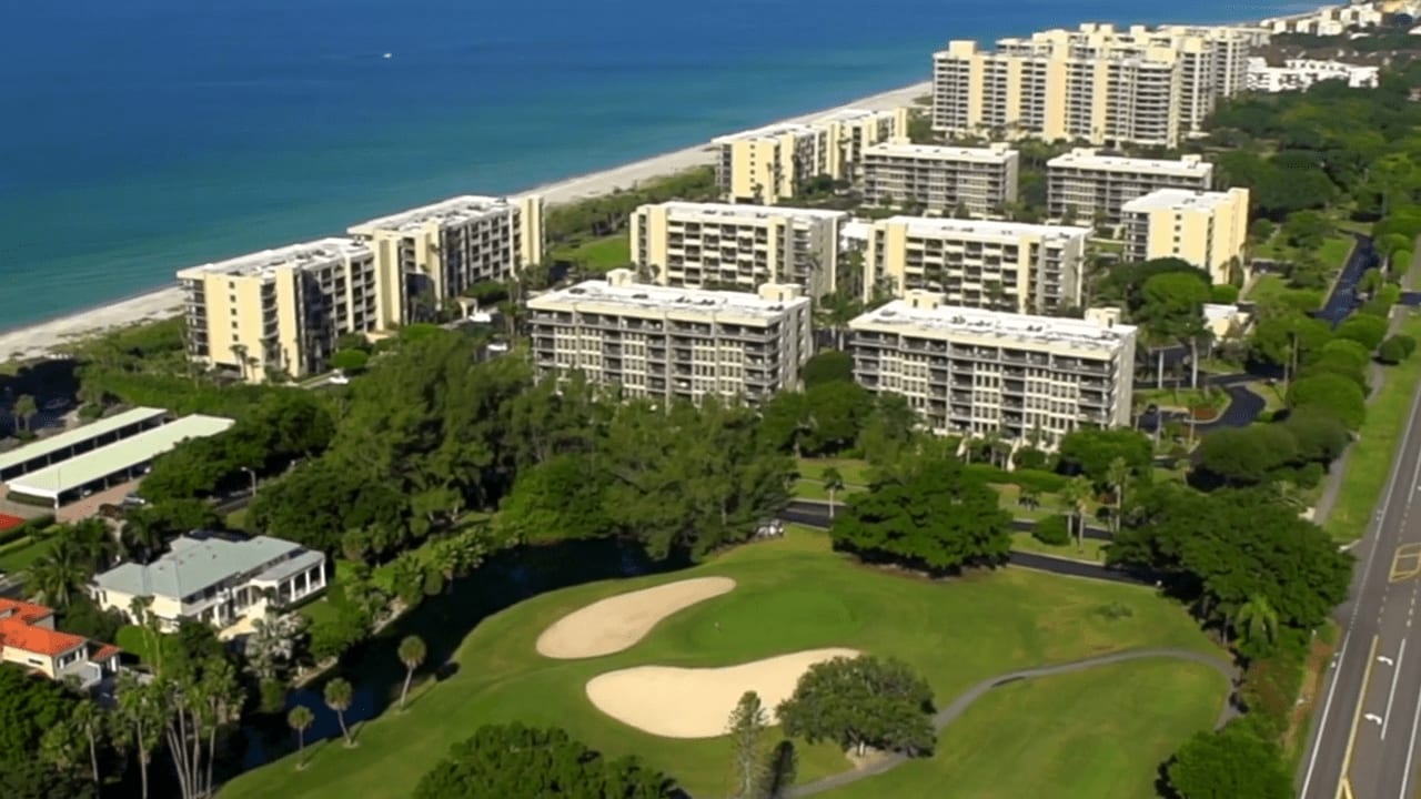 Aerial view of luxury country club resort with beach in the background