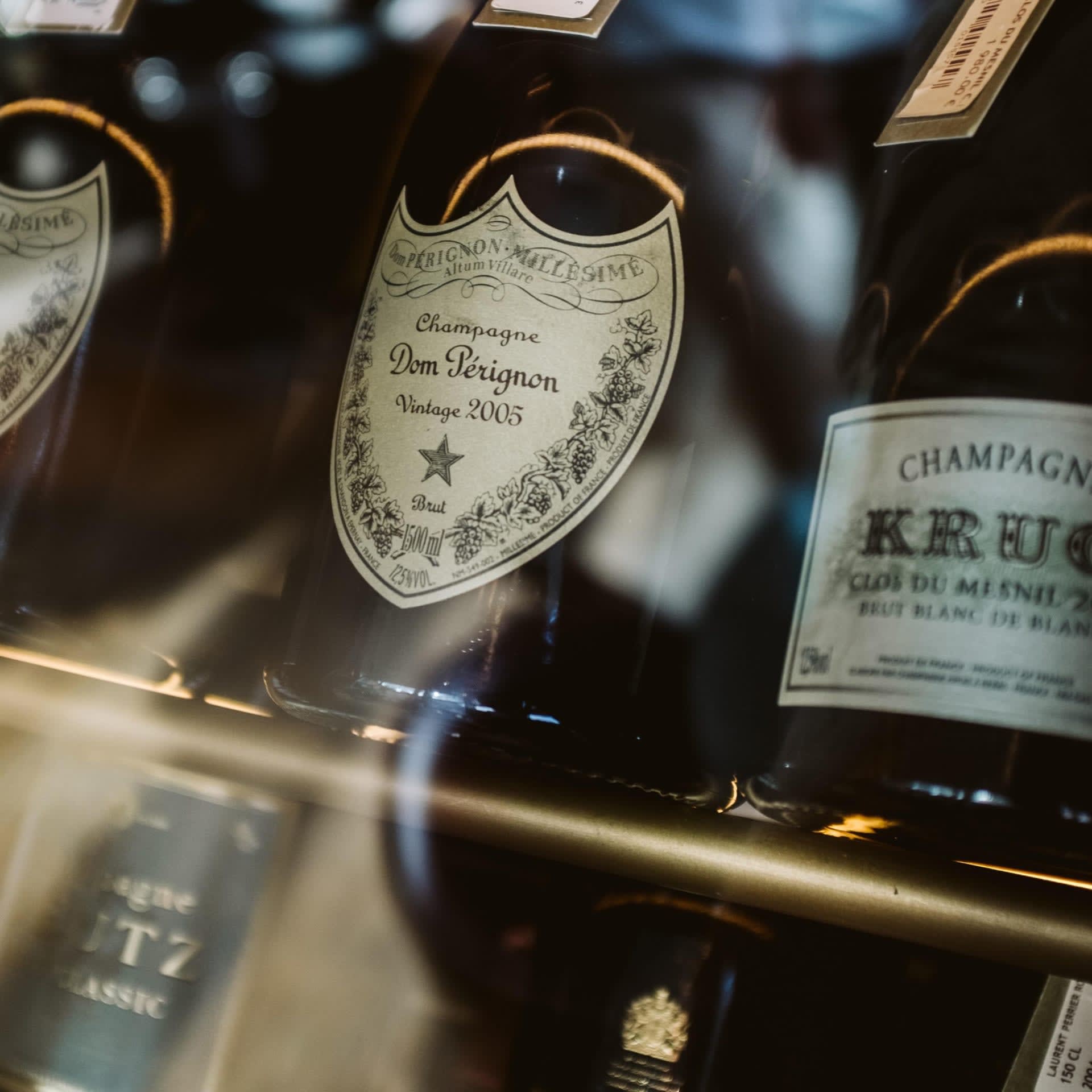 A close-up shot of a bottle of Dom Pérignon Champagne